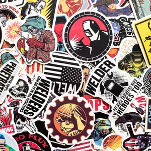 May include: A collection of colorful welder-themed stickers. Designs include a skull welder, American flag, and various welding-related graphics. The stickers feature text like "Welders," "Penetrate with 100%," and "Because Engineers Need Heroes Too."