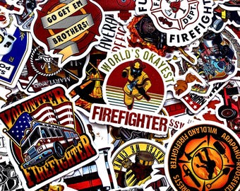 May include: A collection of colorful stickers with various firefighter-themed designs. The stickers feature images of fire trucks, axes, helmets, and the American flag. Text includes "Firefighter," "Go Get Em Brothers!", and "World's Okayest."