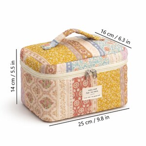 May include: A quilted cosmetic bag with a patchwork design in yellow, pink, and blue floral patterns. The bag measures 9.8 inches long, 6.3 inches wide, and 5.5 inches high. It has a top handle and a zipper closure. The text "today, mood feel the warm" is on a small tag.