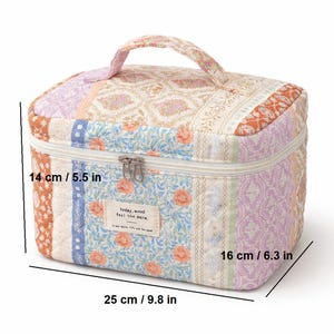 May include: A quilted cosmetic bag with a handle, featuring a patchwork design in various colors including orange, lavender, and blue. The bag measures 9.8 inches long, 6.3 inches wide, and 5.5 inches high. It has a zipper closure and a small tag that reads "today, mood feel the wara."