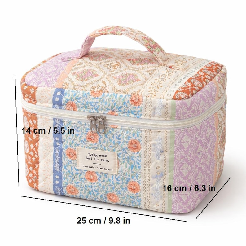 May include: A quilted cosmetic bag with a handle, featuring a patchwork design in various colors including orange, lavender, and blue. The bag measures 9.8 inches long, 6.3 inches wide, and 5.5 inches high. It has a zipper closure and a small tag that reads "today, mood feel the wara."