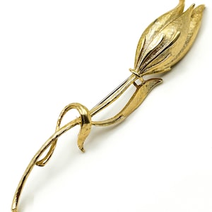 May include: A trio of ceramic mugs with a speckled, matte finish in cream, light grey, and dark grey. Each mug features a simple, minimalist design, ideal for tea or coffee.