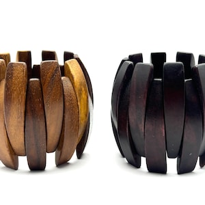 May include: A set of three ceramic mugs with a speckled, matte finish. The mugs are in shades of cream, light gray, and dark gray. Each mug has a simple, minimalist design, perfect for coffee or tea.