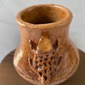 May include: A set of three ceramic mugs with a speckled, matte finish. The mugs are in shades of cream, light gray, and dark gray. Each mug has a simple, minimalist design, perfect for coffee or tea.