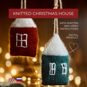 May include: Two knitted Christmas house ornaments. One is red with a white roof, the other is teal with a white roof. Both have white window details. The text "KNITTED CHRISTMAS HOUSE" is at the top.
