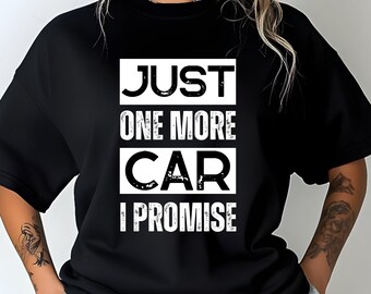 May include: Black crew neck t-shirt with the text "JUST ONE MORE CAR I PROMISE" in a white, bold font. The text is arranged in a stacked format within a rectangular white box.