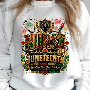 May include: A white crewneck sweatshirt featuring a graphic with the text NURSE JUNETEENTH, COMPASSION, STRENGTH, RESILIENCE, HEALING, We Care. We Heal. We Rise., FREEDOM, HERITAGE, EXCELLENCE, a stethoscope, a syringe, and a raised fist emblem.