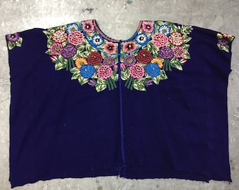 vintage Mexican huipil with floral emboridery