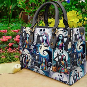May include: A tote bag featuring a collage of images with characters from The Nightmare Before Christmas. The bag has black handles and gold-colored hardware. The background includes flowers and greenery.