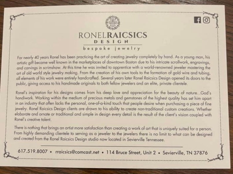 May include: A white card with brown text describing Ronel Raicsics Design, a bespoke jewelry company. The card includes the company's contact information: 617.519.8007, rraicsics@comcast.net, 114 Bruce Street, Unit 2, Sevierville, TN 37876.