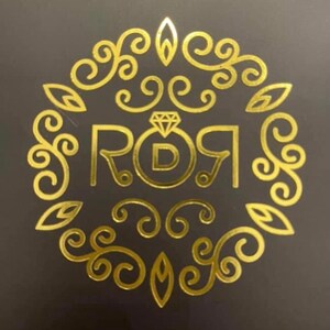 May include: A gold-colored logo with a diamond ring and the text "ROI" with a "D" in the center of the ring.