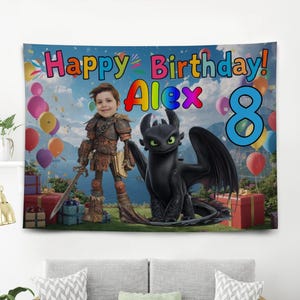 May include: A colorful birthday banner featuring the text "Happy Birthday! Alex 8". The banner includes a cartoon image of a dragon and a person dressed in a costume. Balloons and gift boxes are also visible in the background.