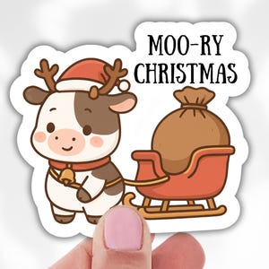 May include: A sticker featuring a cartoon cow wearing a Santa hat and reindeer antlers, pulling a red sleigh with a sack of gifts. The text "MOO-RY CHRISTMAS" is displayed above the sleigh. The cow has brown and white spots and a bell around its neck.