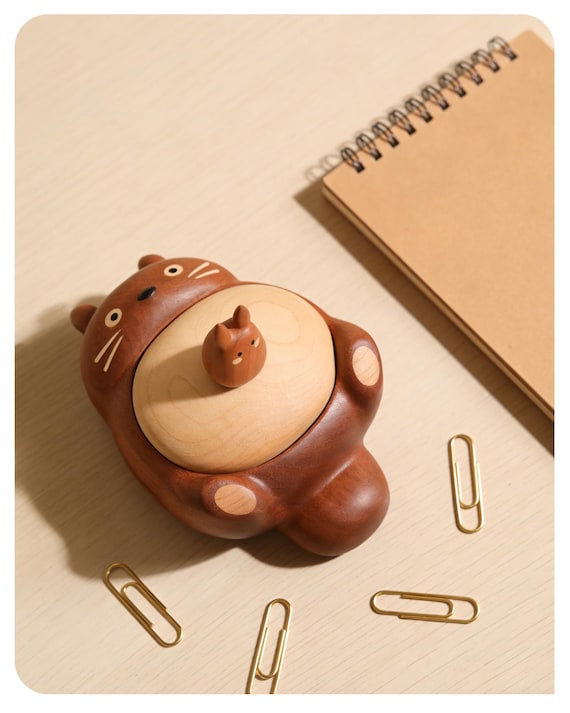 A handmade wooden storage box carved in the likeness of Totoro — equal parts desk organizer and anime shrine piece.