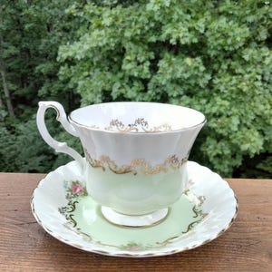 VTG Royal Albert Invitation Series TeaCup and Saucer light green pink rose design w/gold accent made of bone china. Pristine condition.