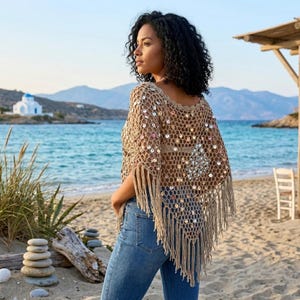 Glittrig paljettvirkad poncho, tofsfåll bohemisk strandaxelbandslös, ihålig stickad sommarsjal