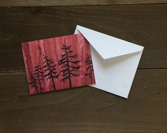 spruce tree silhouette in alaskan wildfire greeting card