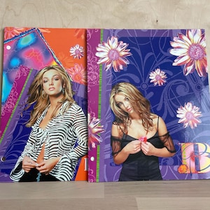 May include: A set of three ceramic mugs with a speckled, matte finish. The mugs are in shades of cream, light gray, and dark gray. Each mug has a simple, minimalist design, perfect for coffee or tea.