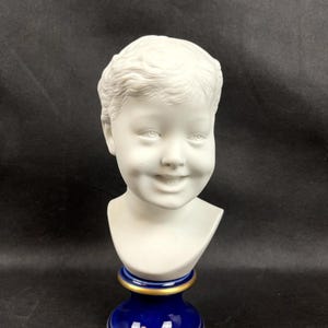 Bust of a laughing child after Donatello in Limoges porcelain biscuit