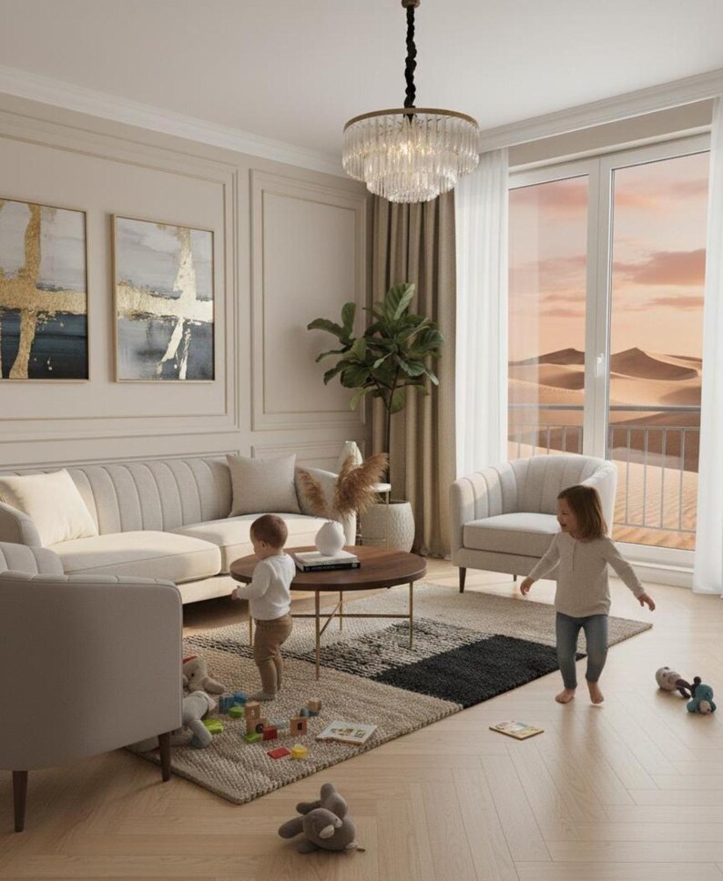 May include: A modern living room with neutral tones, featuring a beige sectional sofa, two armchairs, and a round coffee table. A patterned rug and a crystal chandelier add visual interest. Two children are playing on the floor.