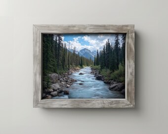 May include: A framed landscape photograph of a river flowing through a forest, with mountains in the background. The water is a light blue, and the trees are green. The frame is made of weathered wood.