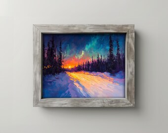 May include: A framed landscape painting depicts a snowy path leading towards a vibrant sunset. The sky transitions from deep blue to orange and yellow, with silhouetted trees lining the horizon. The frame is a weathered gray.