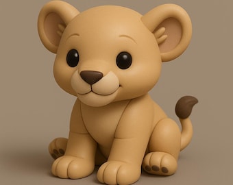 Pode incluir: Uma estatueta de filhote de leão cor de bronzeado com olhos grandes e escuros e um sorriso amigável. O filhote está sentado com as patas para a frente e uma pequena cauda curvada. As orelhas são arredondadas e o nariz é marrom.