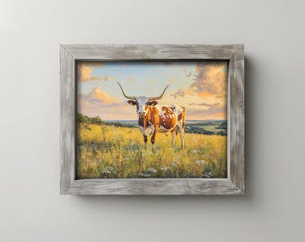 Pode incluir: Pintura emoldurada de um boi de chifres longos em pé em um campo de flores silvestres. O boi tem marcas marrons e brancas e chifres longos e curvos. O céu é uma mistura de azul e laranja, sugerindo um pôr do sol.