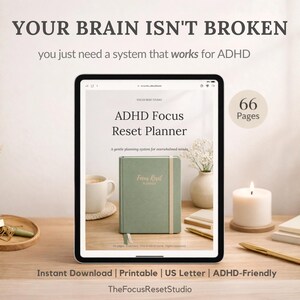 May include: A digital tablet displays the text "ADHD Focus Reset Planner" with a green planner on the screen. The image includes a cup of coffee, a candle, and decorative items. Text at the top reads "YOUR BRAIN ISN'T BROKEN".