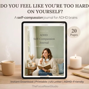 May include: A digital tablet displays the cover of an ADHD Self-Compassion Journal. The image includes a coffee mug, a lit candle, and a pen. Text on the tablet reads, "Do you feel like you're too hard on yourself?" and "A self-compassion journal for ADHD brains."