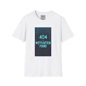 May include: White t-shirt with a graphic on the front. The graphic features the number "404" in a pixelated font, above the words "MOTIVATION FOUND" in a similar style. The design is in shades of blue and teal.