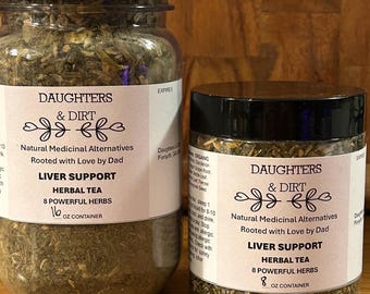 May include: Two glass jars of herbal tea labeled "Daughters & Dirt Liver Support." The larger jar is a 16 oz container, and the smaller jar is an 8 oz container. Both jars have a silver lid and contain dried herbs.