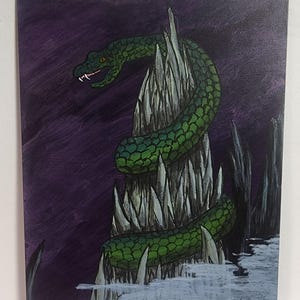 May include: A fantasy art card featuring a green snake coiled around a jagged, icy structure. The card has a purple background and the text "Command Tower" at the top. The snake has a detailed scale pattern.
