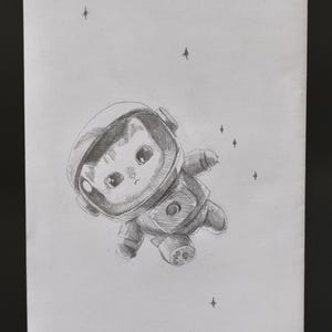 May include: A set of three ceramic mugs with a speckled, matte finish. The mugs are in shades of cream, light grey, and dark grey. Each mug has a simple, minimalist design, ideal for coffee or tea.