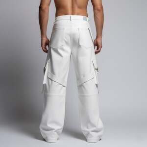 May include: White cargo pants with multiple pockets and straps. The pants have a wide leg design and a silver chain detail. The stitching is visible, and the pants appear to be made of a smooth material.