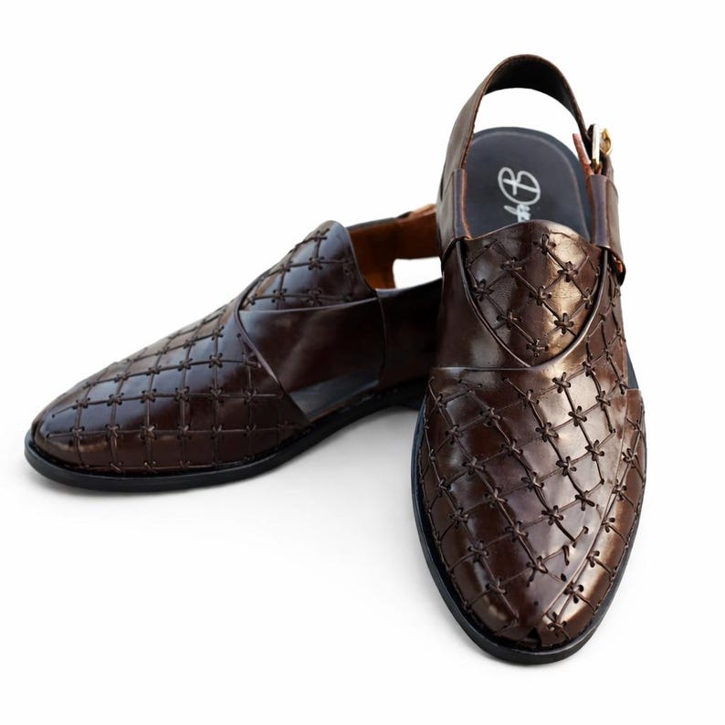 May include: A pair of brown leather sandals with a woven pattern. The sandals have a slingback strap and a pointed toe. The leather is a rich, dark brown color. The soles are black.