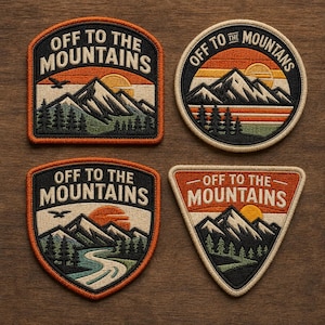 May include: Four embroidered patches featuring a mountain and sunset design. Each patch displays the text "OFF TO THE MOUNTAINS" in white. The patches are in various shapes: a rectangle, a circle, a shield, and a triangle. The patches have a brown border.