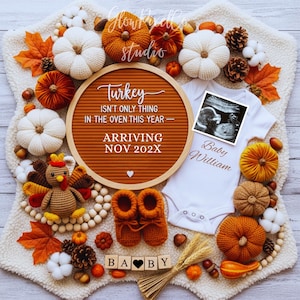 May include: A seasonal baby announcement featuring a brown felt letter board with the text "Turkey isn't only thing in the oven this year - Arriving Nov 202X". Includes a white babygrow, ultrasound image, and crocheted pumpkins.