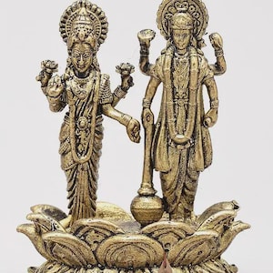 May include: A white ceramic mug with a black handle and the text "But First, Coffee" in a bold, black font. The mug is set against a neutral background, highlighting its simple design.