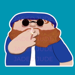 May include: A sticker featuring a cartoon illustration of a person with a red beard, sunglasses, and a blue hat and jacket. The person is smoking a cigarette. The text "JADE JUDE" is repeated on the sticker.