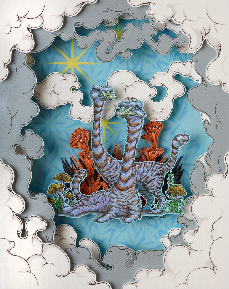May include: A layered paper art piece featuring two long-necked creatures with blue and brown striped bodies, set against a blue background with orange plants and mushrooms. The artwork is framed by stylized clouds.