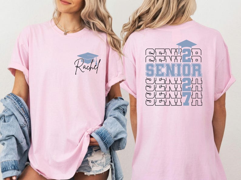 Senior class 2027 t shirt featuring bold graduation typography, personalized name customization and graduation cap graphic on a blue Comfort Colors shirt suitable for graduation parties and keepsake gifts. Graduation celebration shirt showcasing custom student name, senior year 2027 artwork and layered typography design printed on a comfortable blue Comfort Colors t shirt for high school graduates.