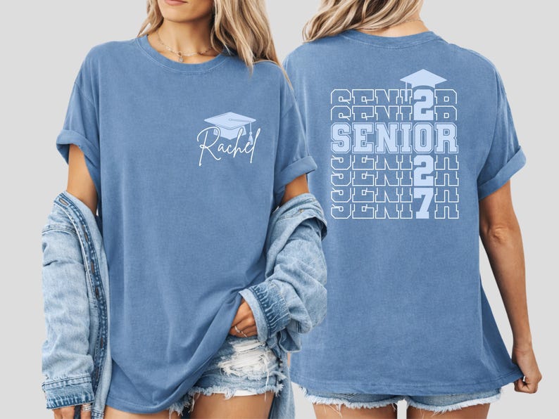 Class of 2027 senior shirt featuring stacked typography artwork, graduation themed design elements and personalized name customization on a blue vintage style Comfort Colors t shirt for memorable celebrations. Custom Class of 2027 senior shirt with repeating senior text design and personalized name graphic displayed on a vintage style blue Comfort Colors tee for graduation celebrations.