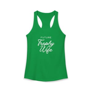 May include: A green racerback tank top with the words "FUTURE Trophy Wife" in white script. The tank top is made of a soft material and has a scoop neck and racerback design. The text is centered on the front of the shirt.