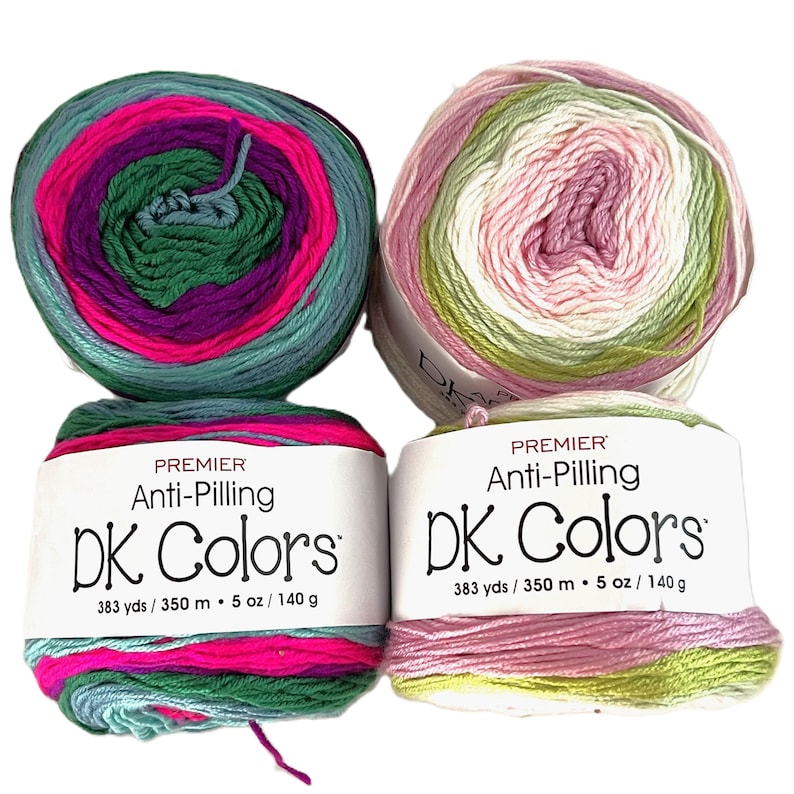 May include: Two skeins of Premier DK Colors anti-pilling yarn. One skein features teal, pink, purple, and green, while the other has pink, white, and green. Each skein is labeled with the text "Premier Anti-Pilling DK Colors" and contains 383 yards of yarn.