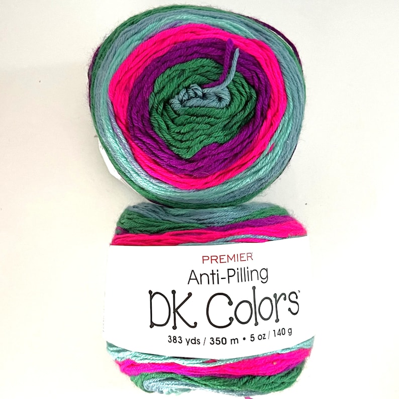 May include: Two skeins of Premier Anti-Pilling DK Colors yarn. The yarn is a mix of colors including teal, pink, purple, and green. The label reads "DK Colors" and lists the yardage and weight as 383 yds / 5 oz / 140 g.