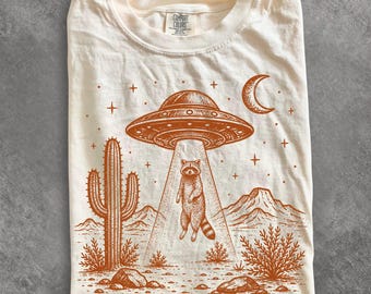 UFO Raccoon Shirt, Funny Alien Abduction Wildlife Graphic Tee, Retro Sci Fi T-Shirt, Raccoon Lover Gift, Comfort Colors Tee, Paranormal Gift