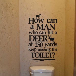 Deer wall decal How can a man who can hit a deer decal lettering sticker bathroom humor funny signage KW738 image 1