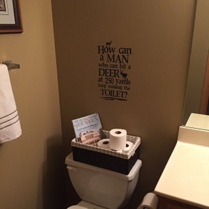 Deer wall decal How can a man who can hit a deer decal lettering sticker bathroom humor funny signage KW738 image 2