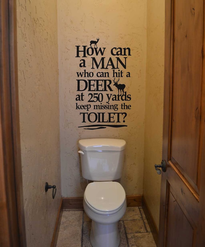 Deer wall decal How can a man who can hit a deer decal lettering sticker bathroom humor funny signage KW738 image 1